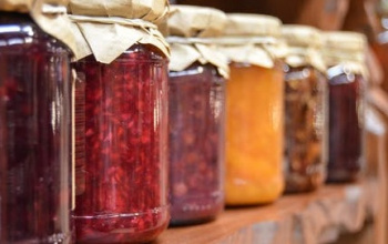 Jams in mason jars on a shelf